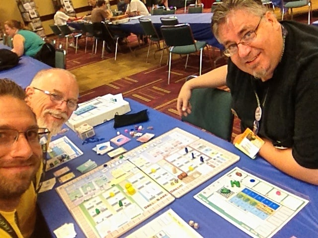 Luke, Tom Jolly, James Mathe playing an early prototype of The Manhattan Project: Energy Empire