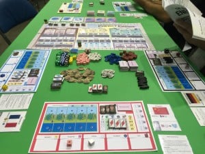 In Manhattan Project: Energy Empire, players must balance many resources: money, plastic, steel, science, oil, workers, energy, and even a clean environment.